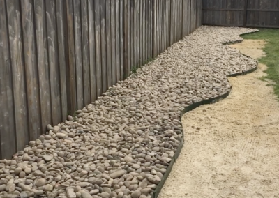 drainage to prevent runoff from neighbors, river rocks for yard